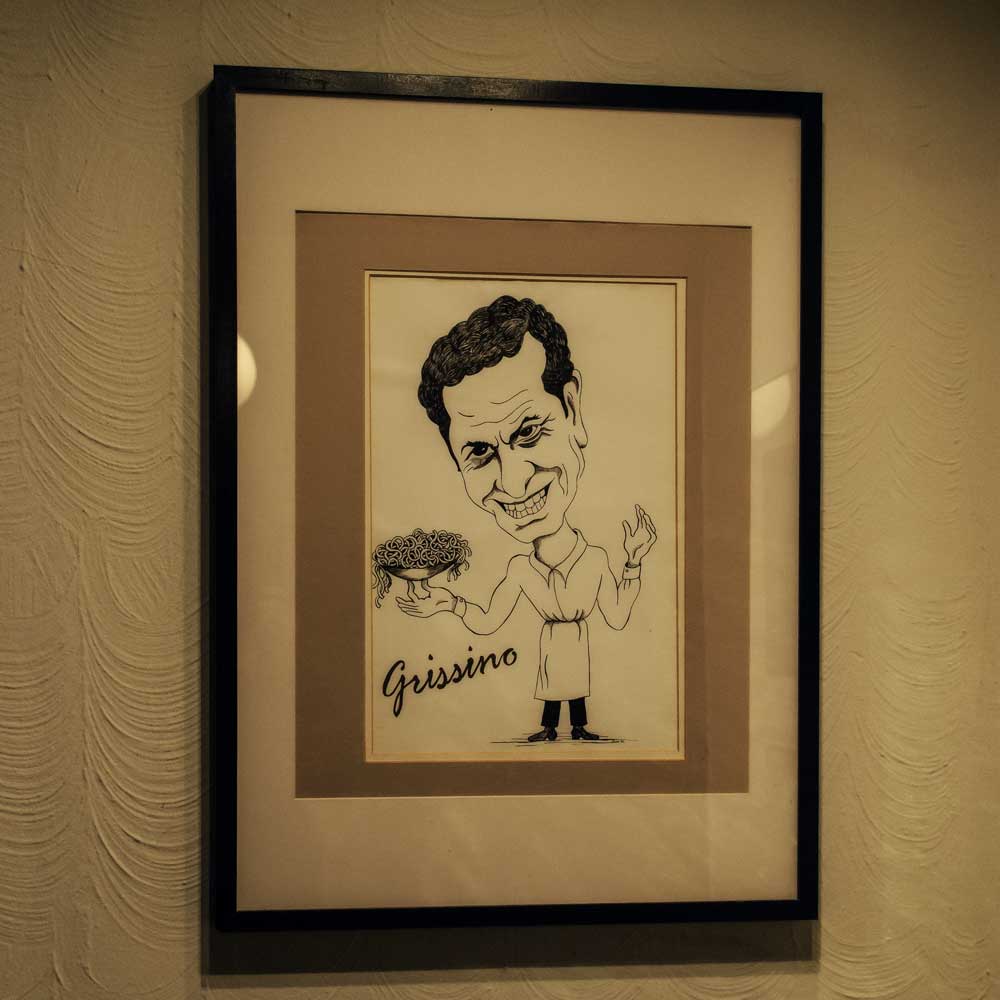 Gerahmte Grissino-Karikatur im bisherigen Restaurant